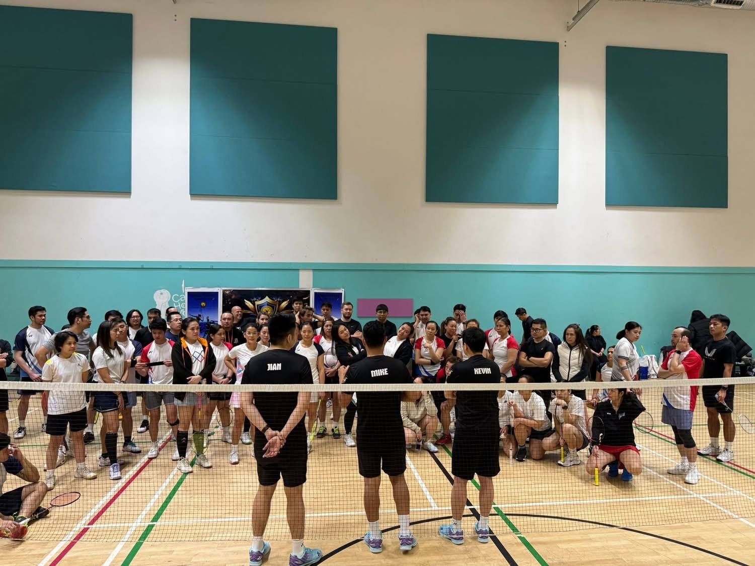 Organisers briefing a full hall of players before play