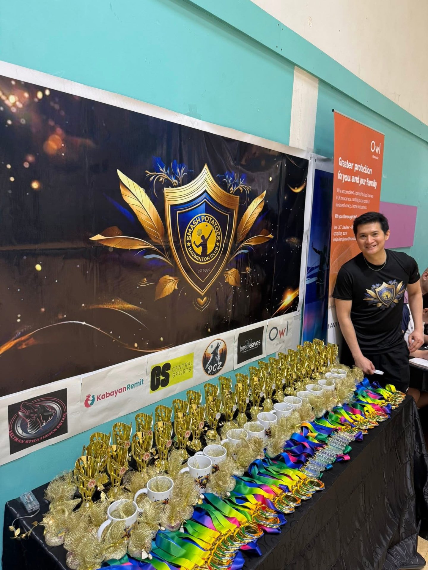 Trophies, mugs and medals laid out beneath the Smash Potatoes crest banner